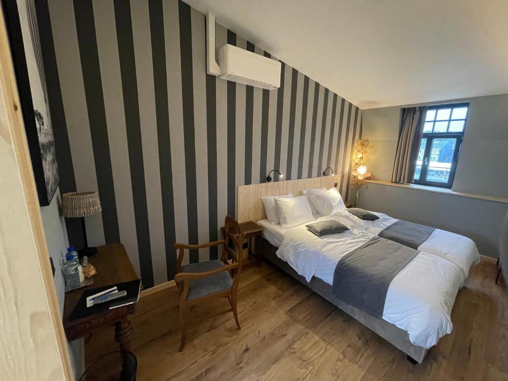 Postel nebo postele na pokoji v ubytování Hôtel Maison Demelenne