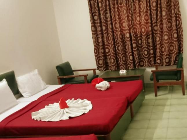 Voodi või voodid majutusasutuse Hotel Ranjit Residency toas