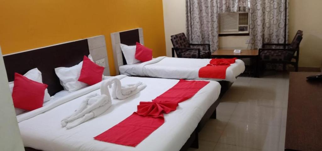 Voodi või voodid majutusasutuse Hotel Ranjit Residency toas
