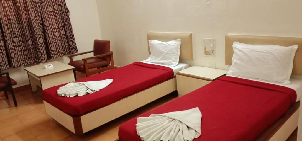 Voodi või voodid majutusasutuse Hotel Ranjit Residency toas