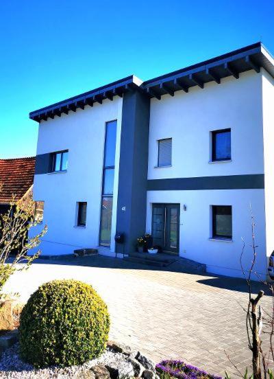 a large white building with aventh floor at Ferienwohnung in der Rhön Sitzmann in Bischofsheim an der Rhön