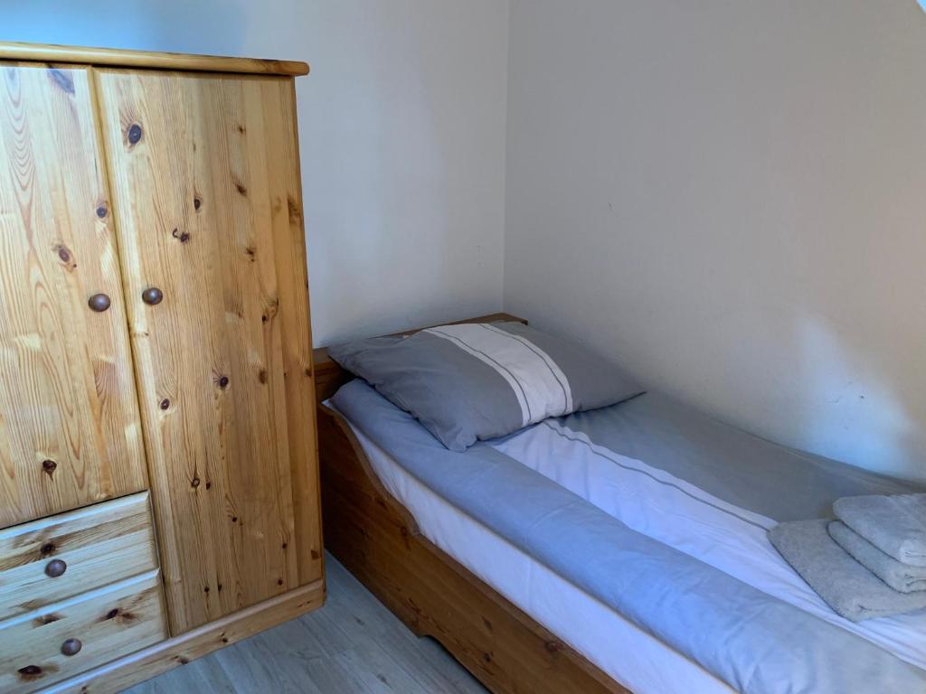 Postel nebo postele na pokoji v ubytování Ferienwohnung "Neptun" im Haus Tjark