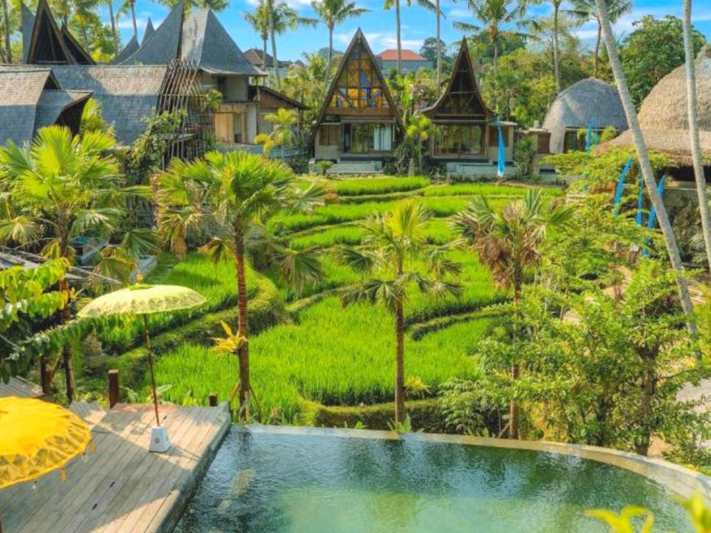 an aerial view of a resort with a swimming pool at Menzel Ubud in Ubud