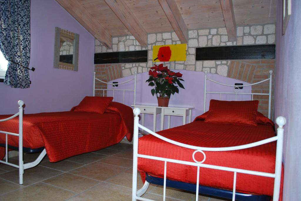 Postel nebo postele na pokoji v ubytování Sosta Fiera B&B
