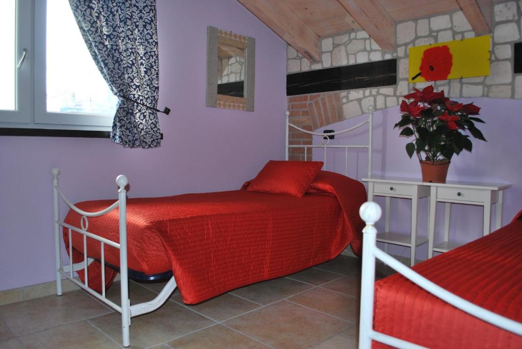 Postel nebo postele na pokoji v ubytování Sosta Fiera B&B