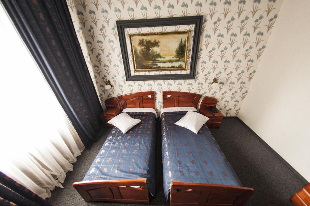 Postel nebo postele na pokoji v ubytování Bucharest Comfort Suites Hotel