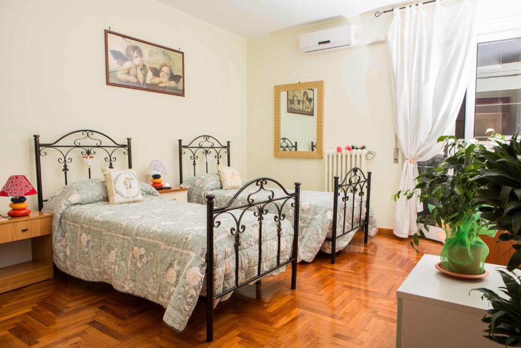 Łóżko lub łóżka w pokoju w obiekcie B&B Stupor Mundi