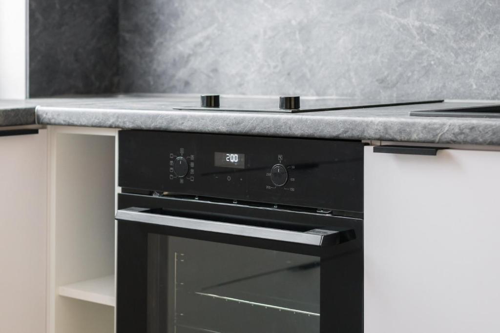 Kuchyňa alebo kuchynka v ubytovaní Kosińskiego Apartment Poznań by Noclegi Renters