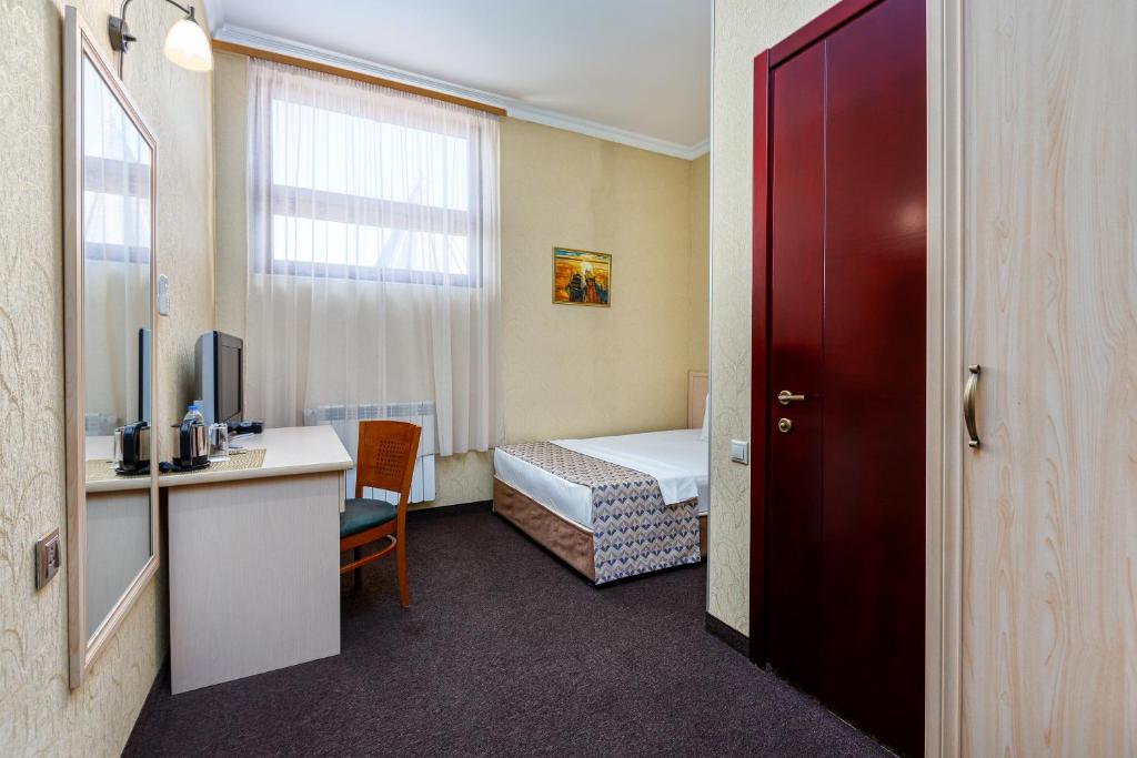 Postel nebo postele na pokoji v ubytování Sharden Hotel