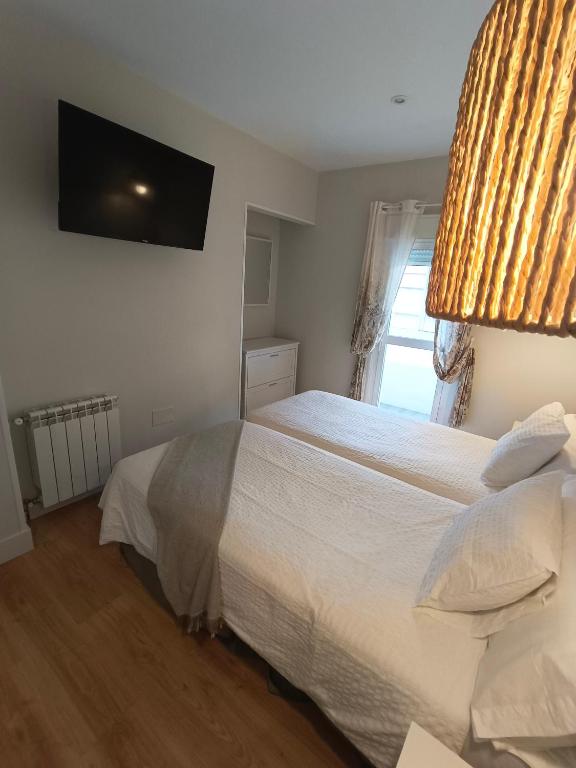 Posteľ alebo postele v izbe v ubytovaní Hotel Posada del Mar