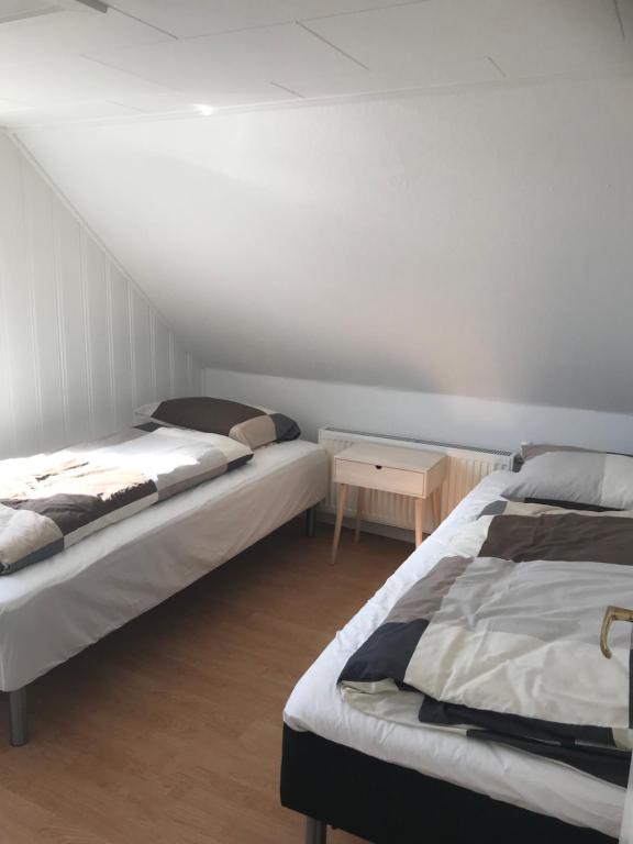Postel nebo postele na pokoji v ubytování Seaside Top