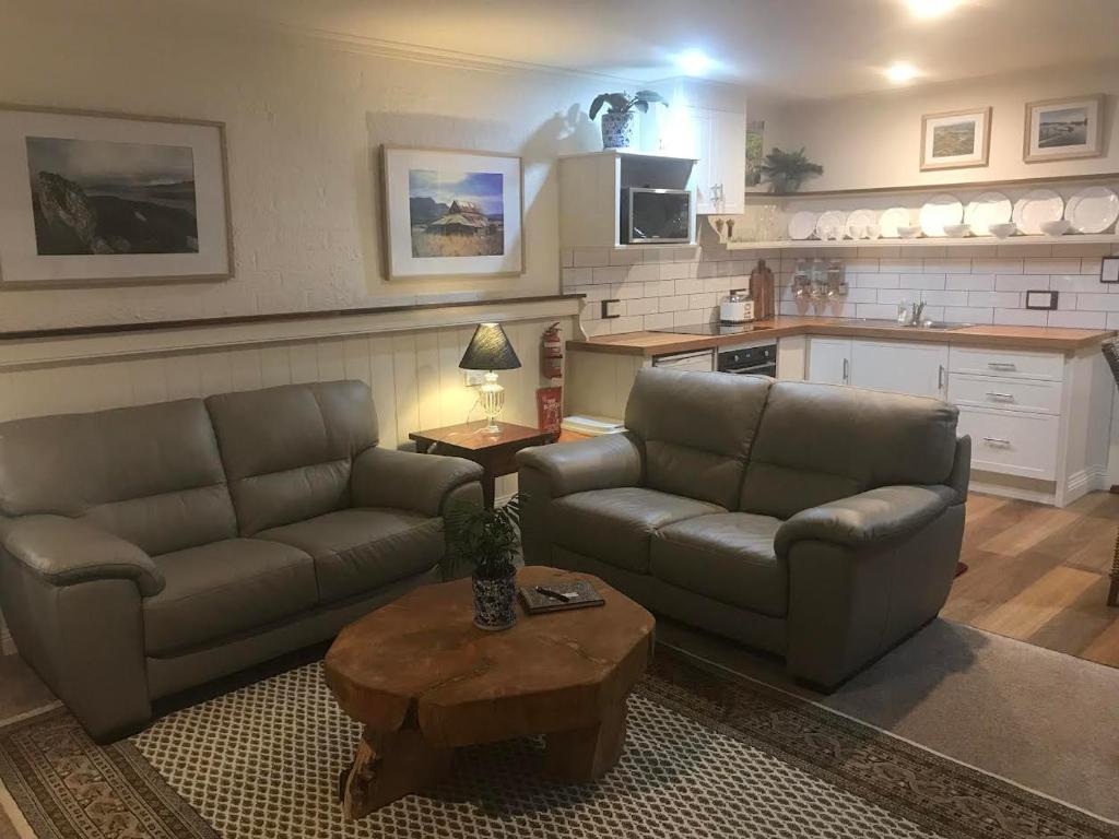 a living room with two couches and a coffee table at Silwood Apartment fully self contained with Kitchen and Laundry in Devonport