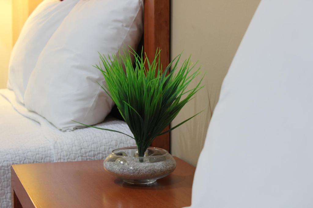 Postel nebo postele na pokoji v ubytování Hotel Marllou