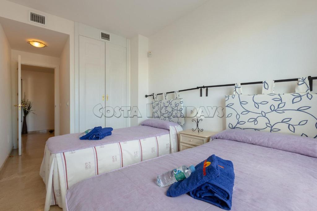 Postel nebo postele na pokoji v ubytování Marina real 223