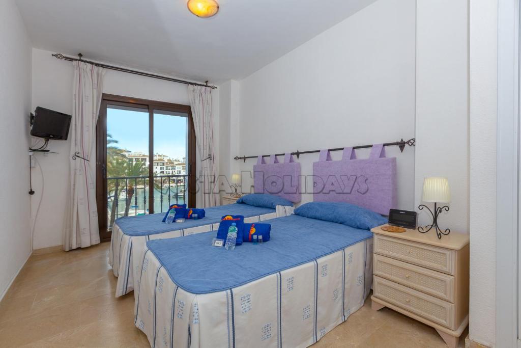 Postel nebo postele na pokoji v ubytování Marina real 223