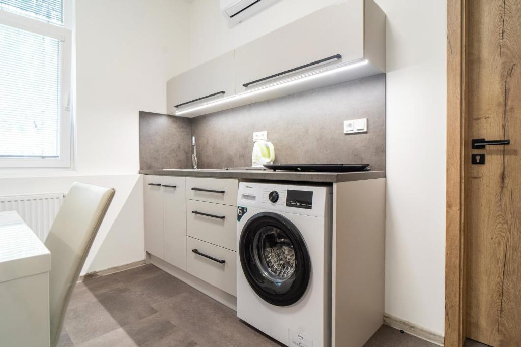 Kuchyň nebo kuchyňský kout v ubytování Apartmány U Jiříka