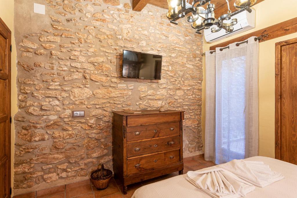 TV a/nebo společenská místnost v ubytování Casa rural, la Bóveda