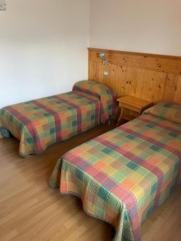 Postel nebo postele na pokoji v ubytování Albergo Ristorante Baraglia
