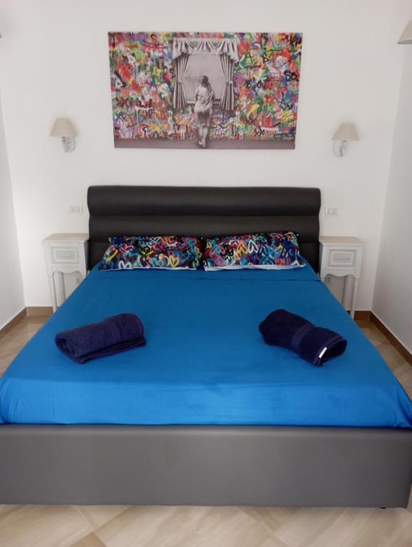 A bed or beds in a room at Cozy Loft Putignani