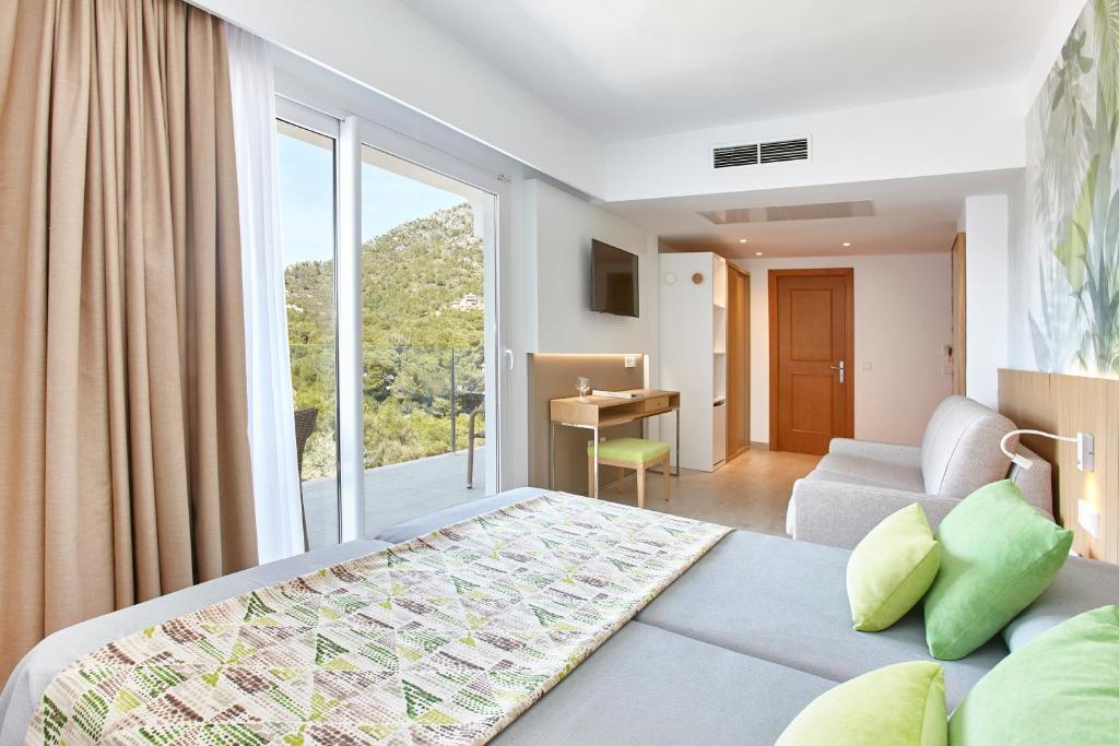 Postel nebo postele na pokoji v ubytování Universal Hotel Castell Royal