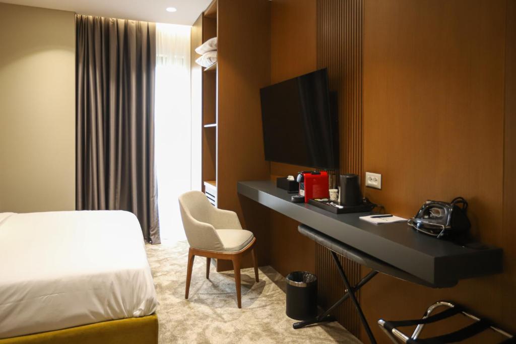 Postel nebo postele na pokoji v ubytování Urbanin Apartment & Hotel