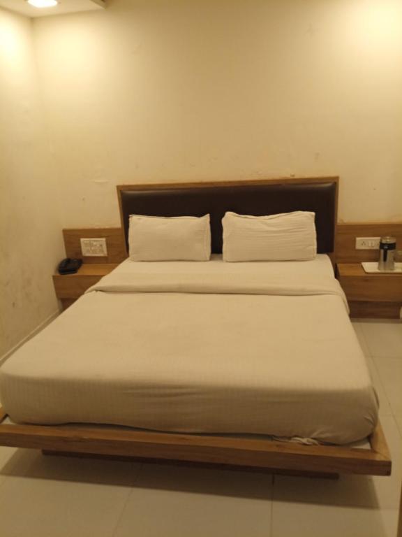 Postel nebo postele na pokoji v ubytování Hotel Maan Palace
