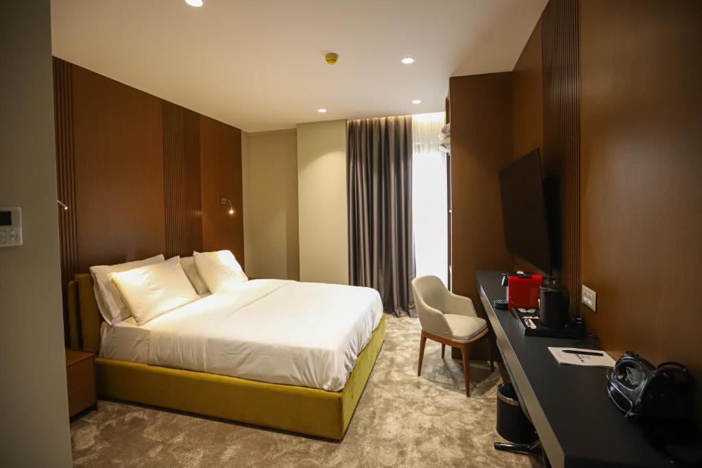 Postel nebo postele na pokoji v ubytování Urbanin Apartment & Hotel