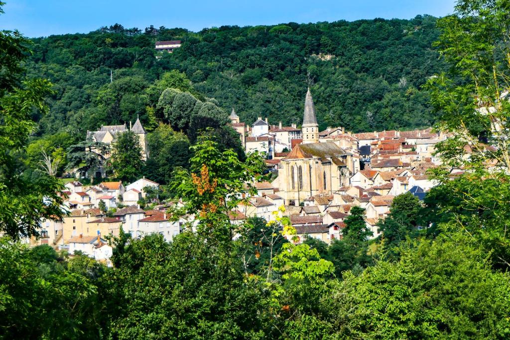 a cityscape of a town in the hills at Village Bord de Ciel in Caylus