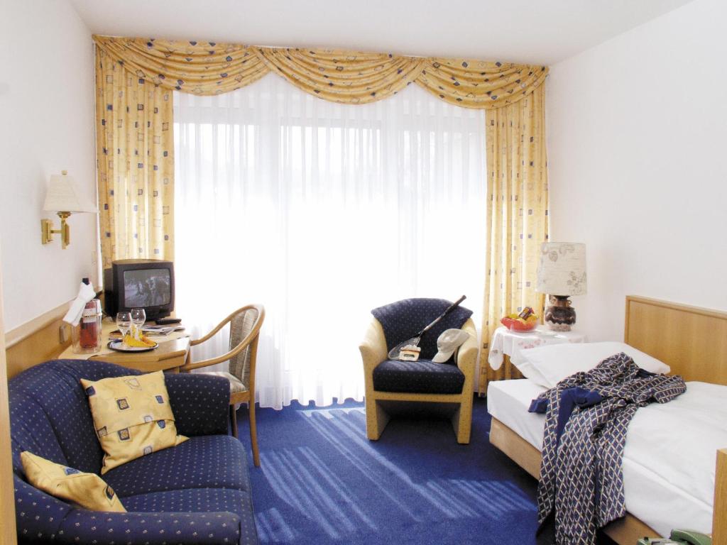 Postel nebo postele na pokoji v ubytování Vital-Hotel Erika