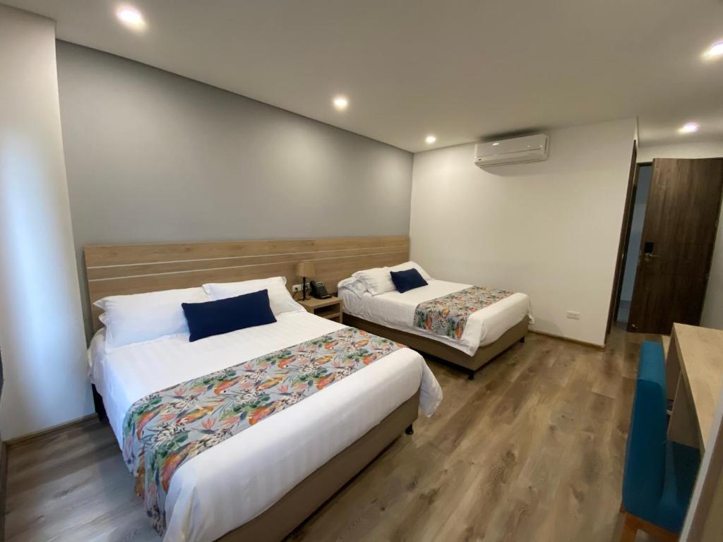 Postel nebo postele na pokoji v ubytování EcoHub Hotel Medellin