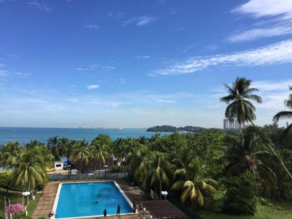 a view of the ocean from a resort at Comfy Beachfront View at Seri Bulan Condominium Teluk Kemang Beach in Port Dickson