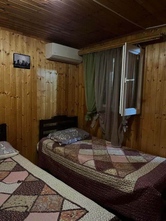 Postel nebo postele na pokoji v ubytování Guest House Yana