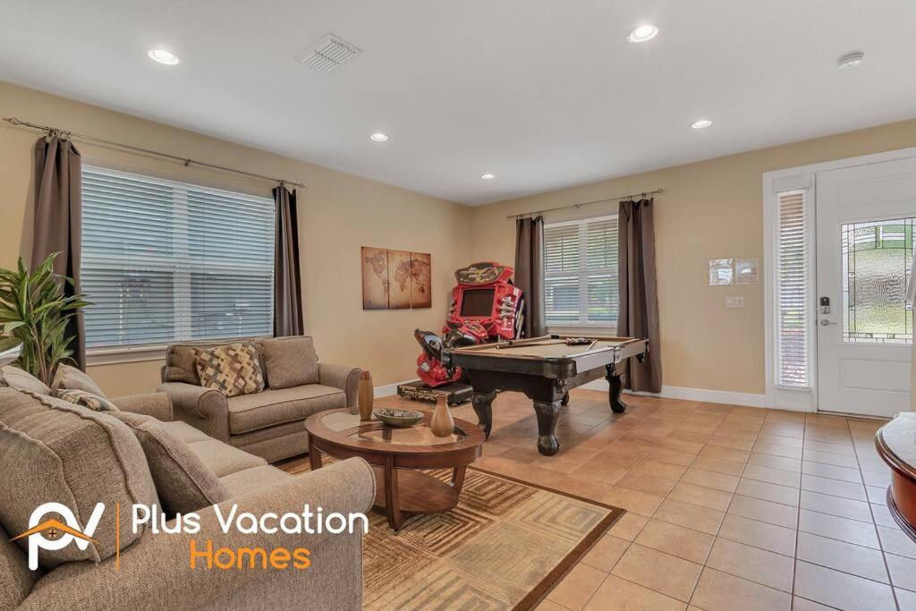a living room with a ping pong table at 371-Luxury Villa with POOL in Orlando