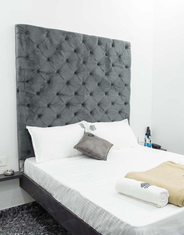 Postel nebo postele na pokoji v ubytování JSM Residency