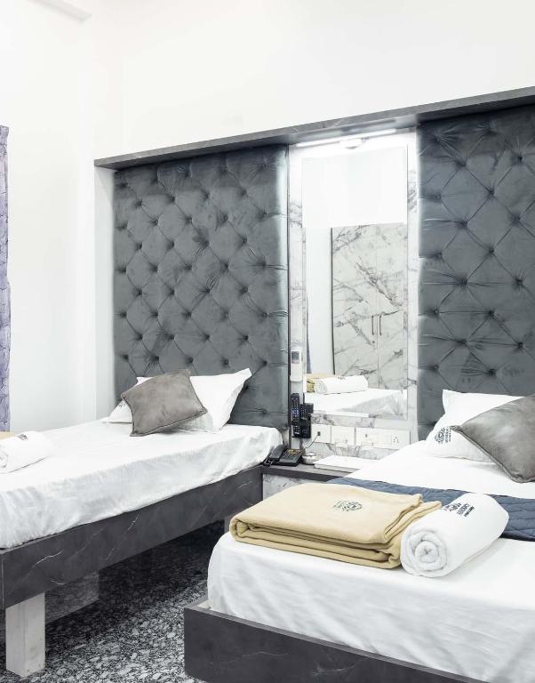 Postel nebo postele na pokoji v ubytování JSM Residency