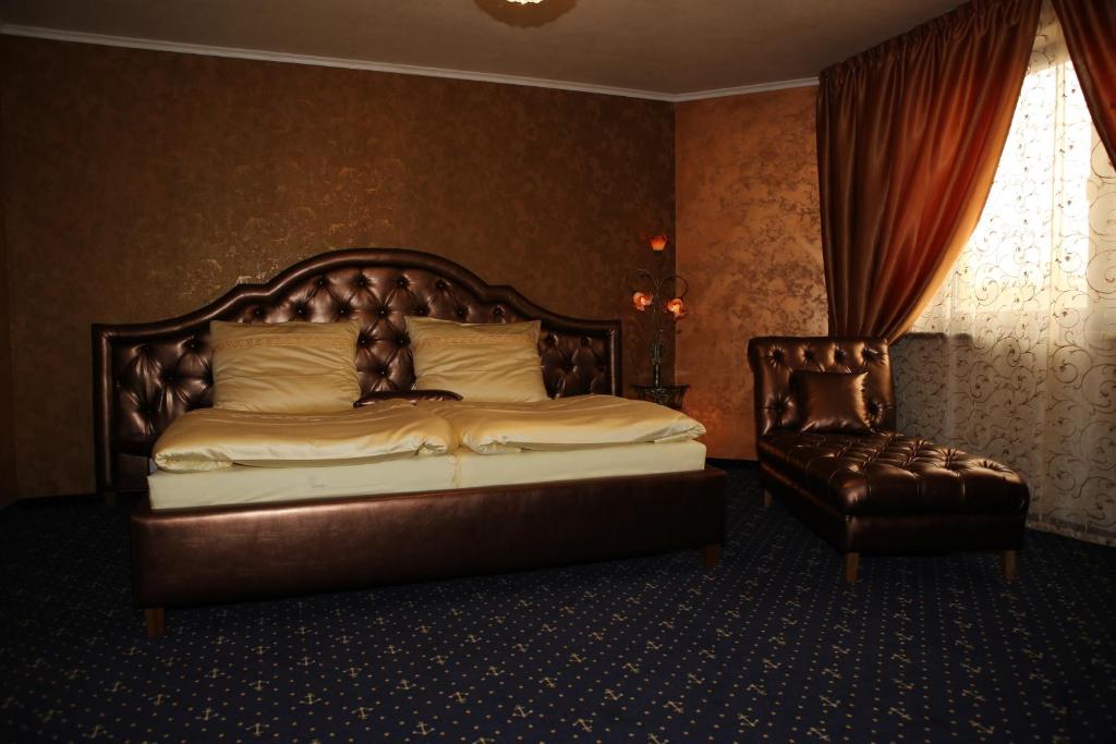 Postel nebo postele na pokoji v ubytování Hotel Kotva