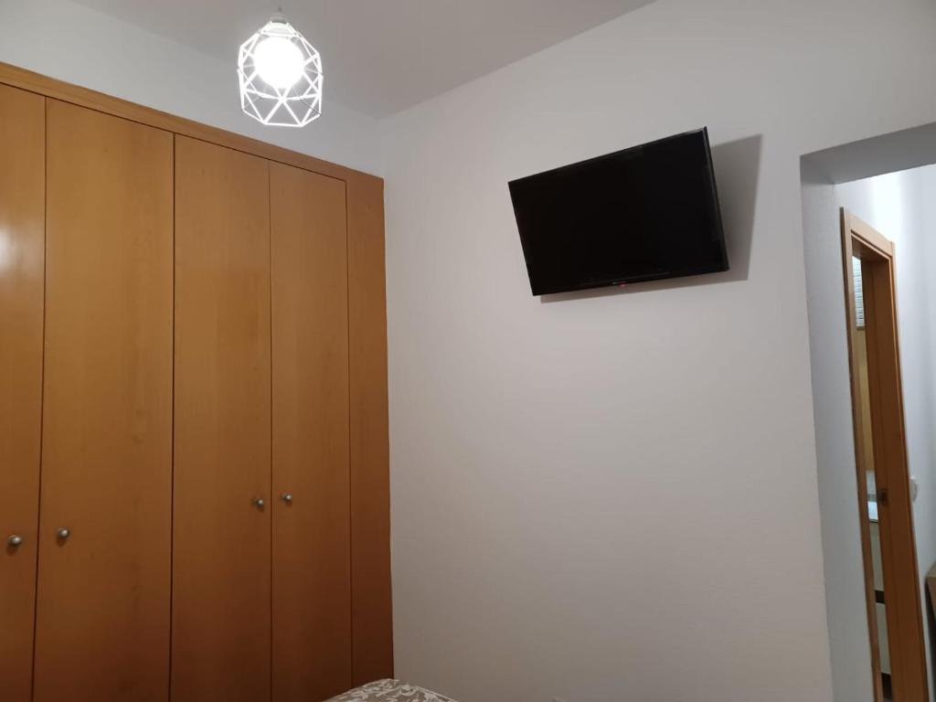 A television and/or entertainment centre at For You Rentals TEMPORAL Infantas Gran Via INF2E