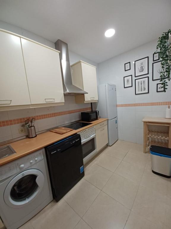 A kitchen or kitchenette at For You Rentals TEMPORAL Infantas Gran Via INF2E