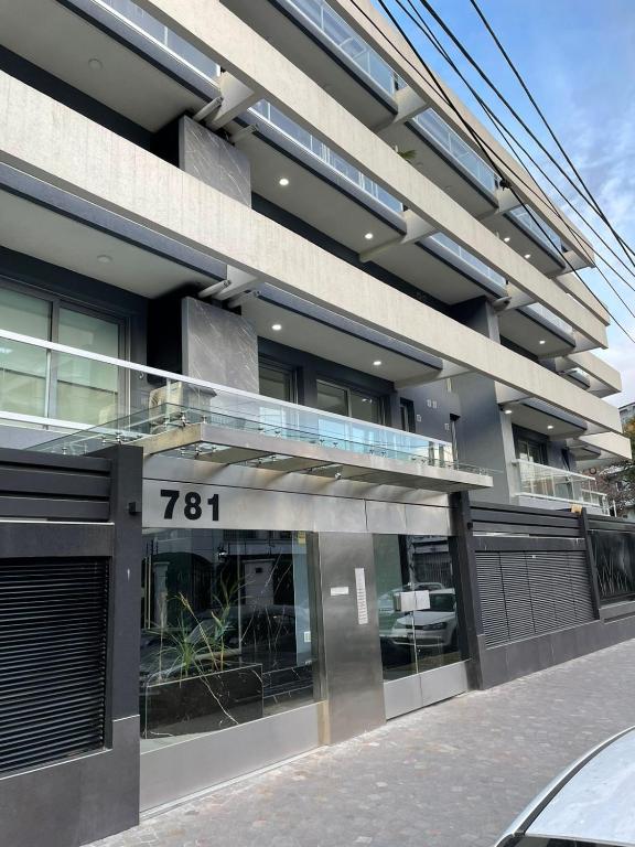 a building with a sign on the front of it at PELLERANO APARTMENT in Adrogué