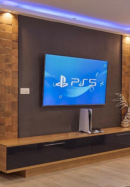Televízia a/alebo spoločenská miestnosť v ubytovaní Luxury Apartment City Centre