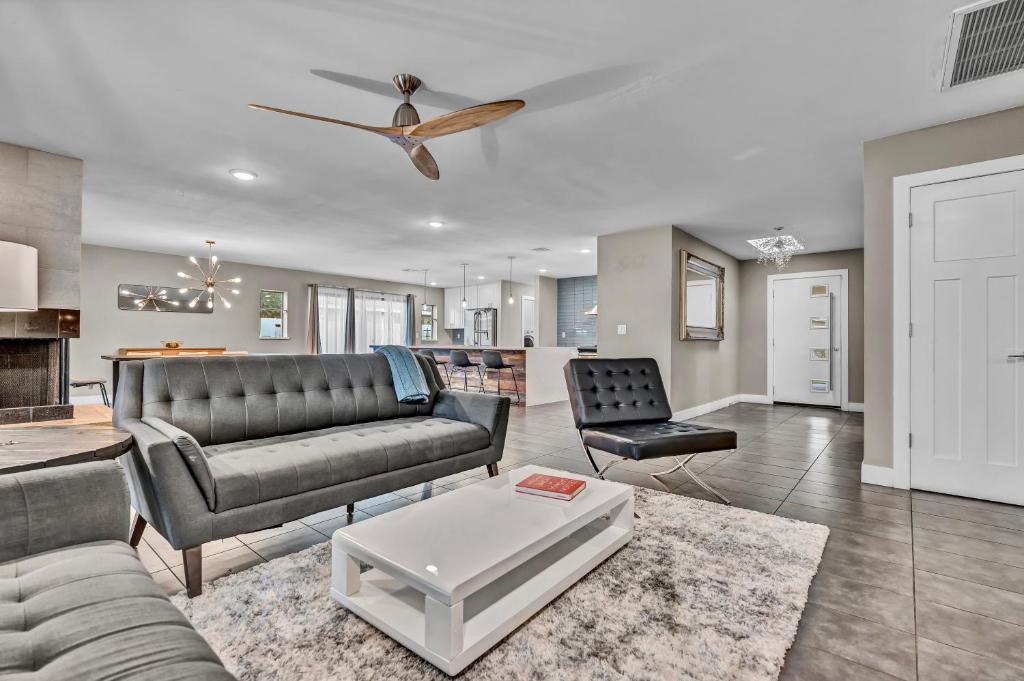 a living room with a couch and a table at Quiet Contemporary Executive 4BD, 3BA Estate with Pool in Tempe