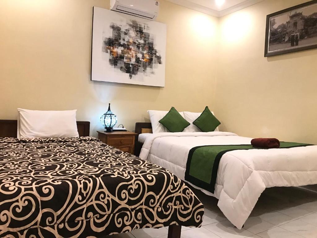 Postel nebo postele na pokoji v ubytování Monka House