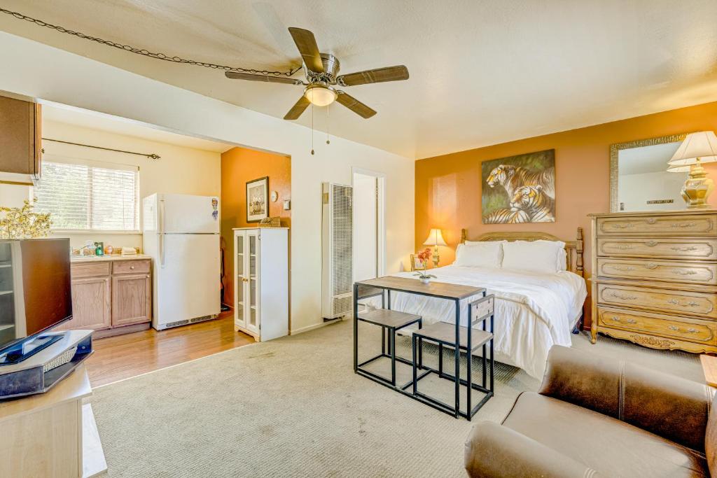 a bedroom with a bed and a living room at Pine Tree Place - Unit 4 in South Lake Tahoe