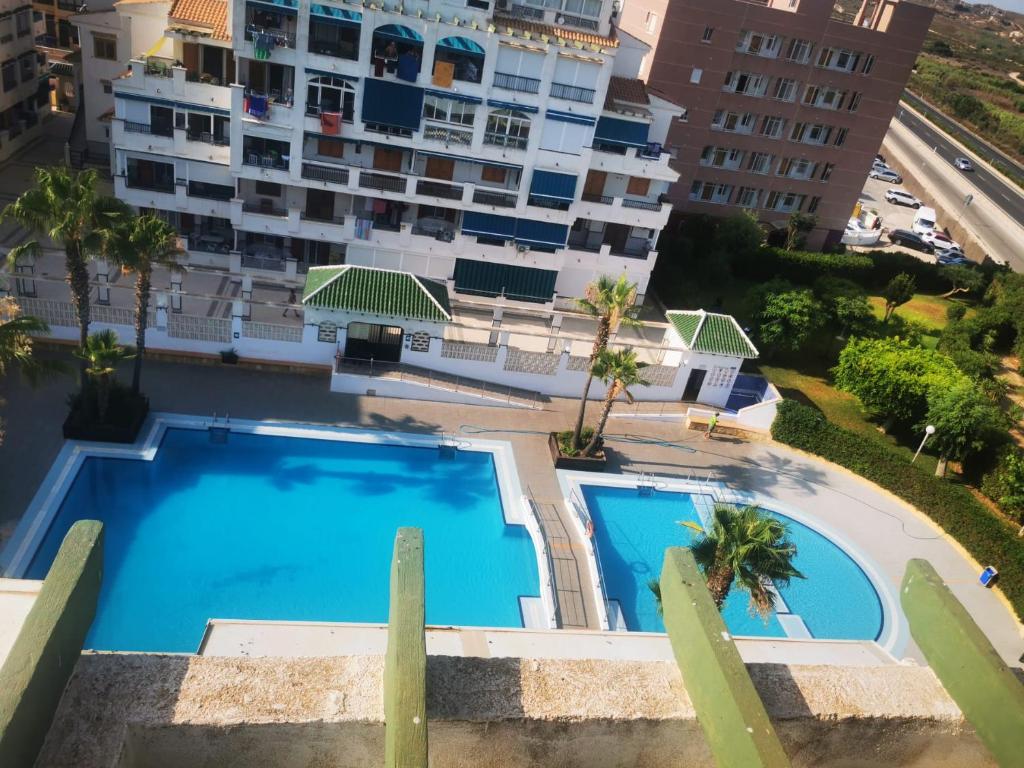 Bazén v ubytování Apartament pod Palmami /Bajo las Palmeras nebo v jeho okolí