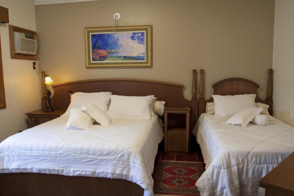 Postel nebo postele na pokoji v ubytování Hotel Pousada Florença