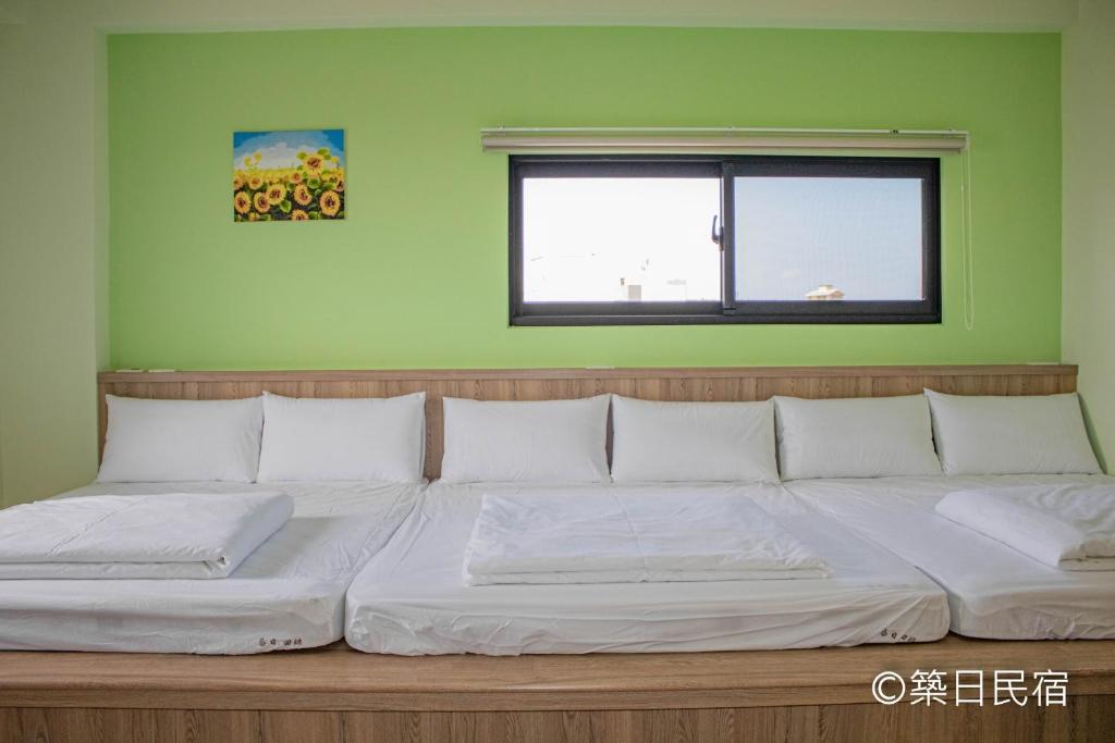Postel nebo postele na pokoji v ubytování Chikubi Homestay