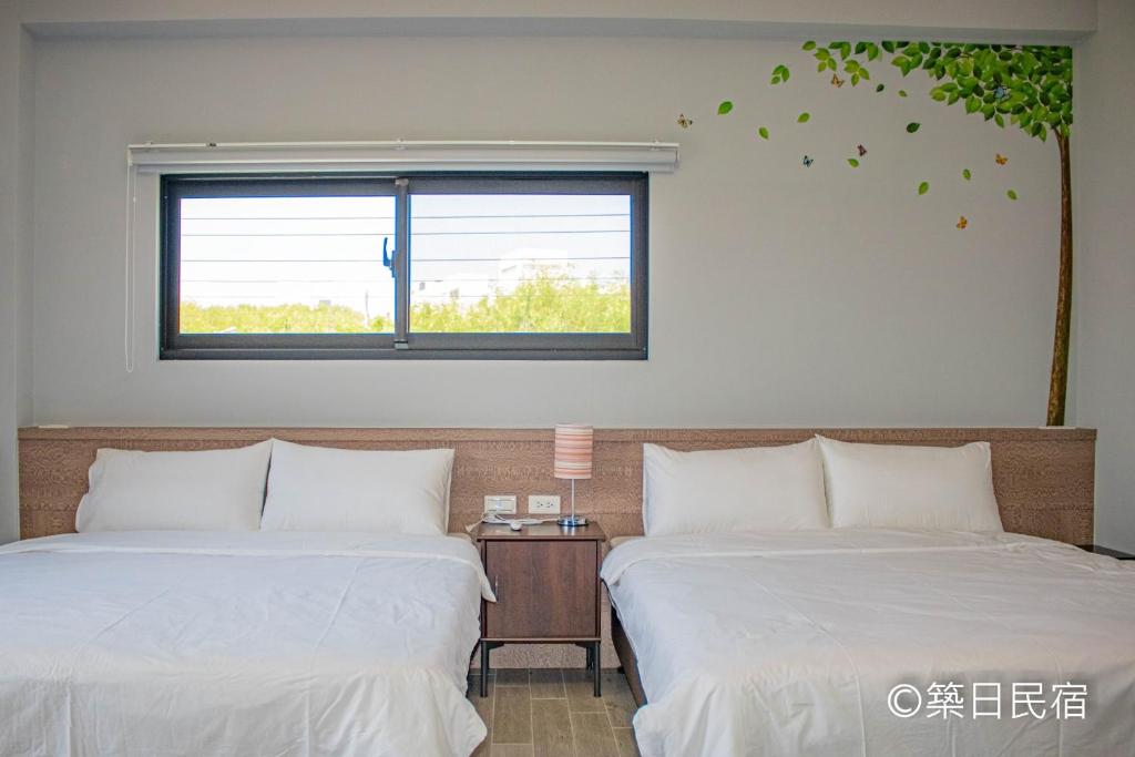 Postel nebo postele na pokoji v ubytování Chikubi Homestay