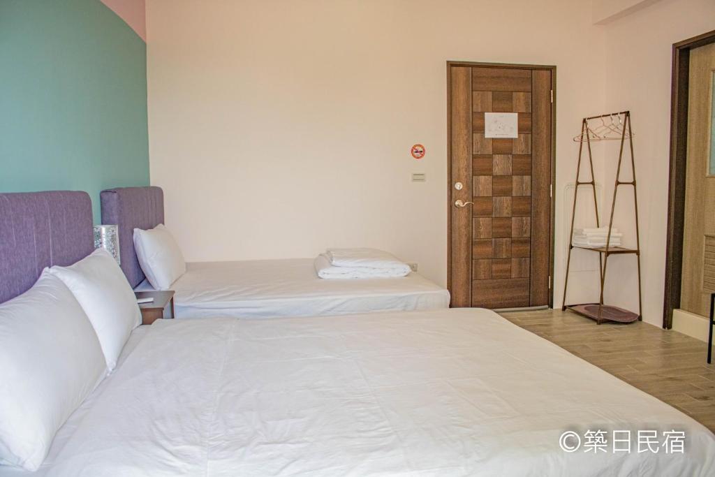 Postel nebo postele na pokoji v ubytování Chikubi Homestay