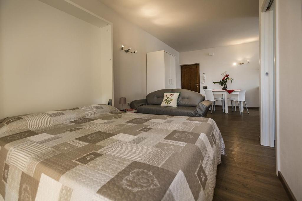 Postel nebo postele na pokoji v ubytování Le Servite Apartments
