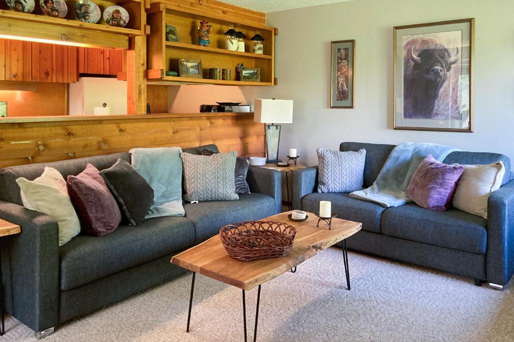 a living room with two couches and a coffee table at 3614 Winterberry in Wilson